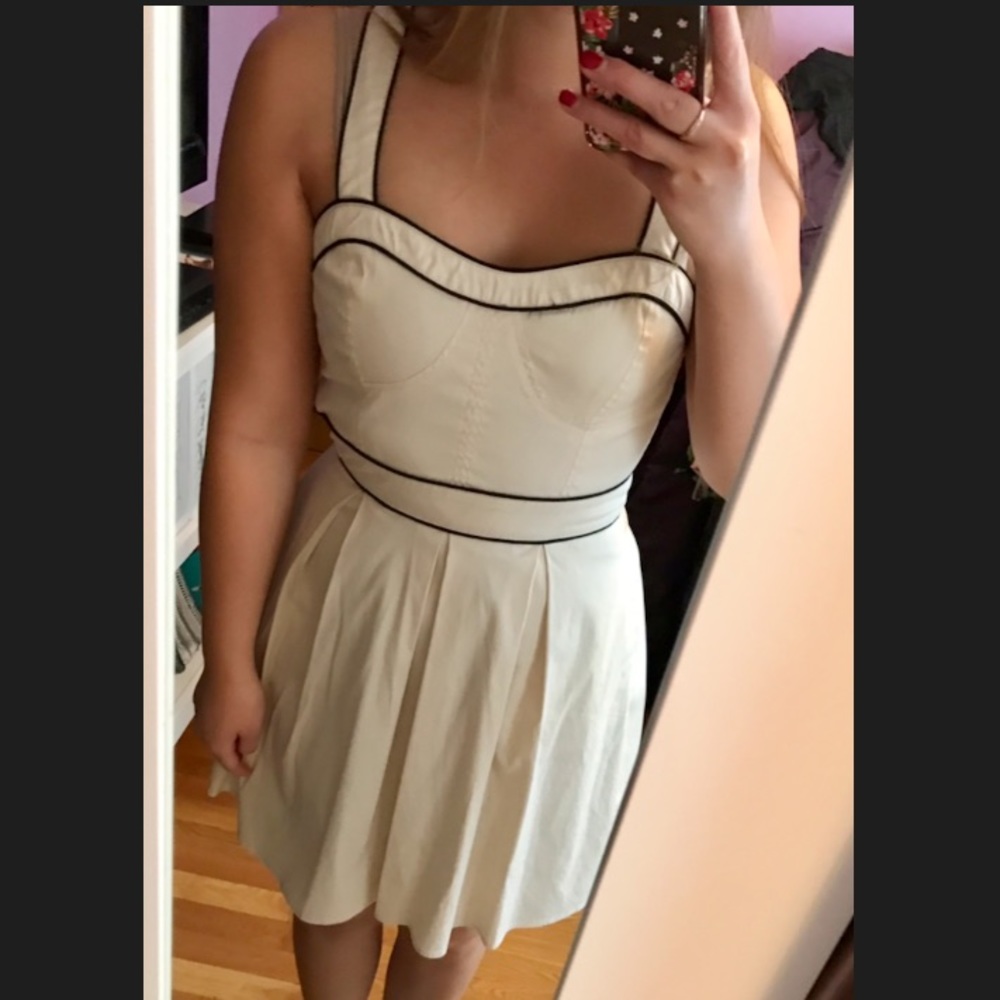Ivory dress with black pipe lines